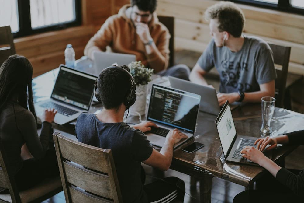 Colleagues working together around a table